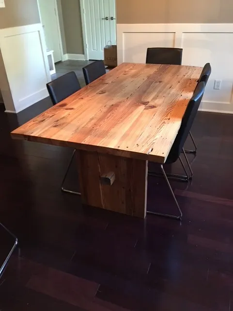 Farmhouse table built from 100-year-old reclaimed heart pine